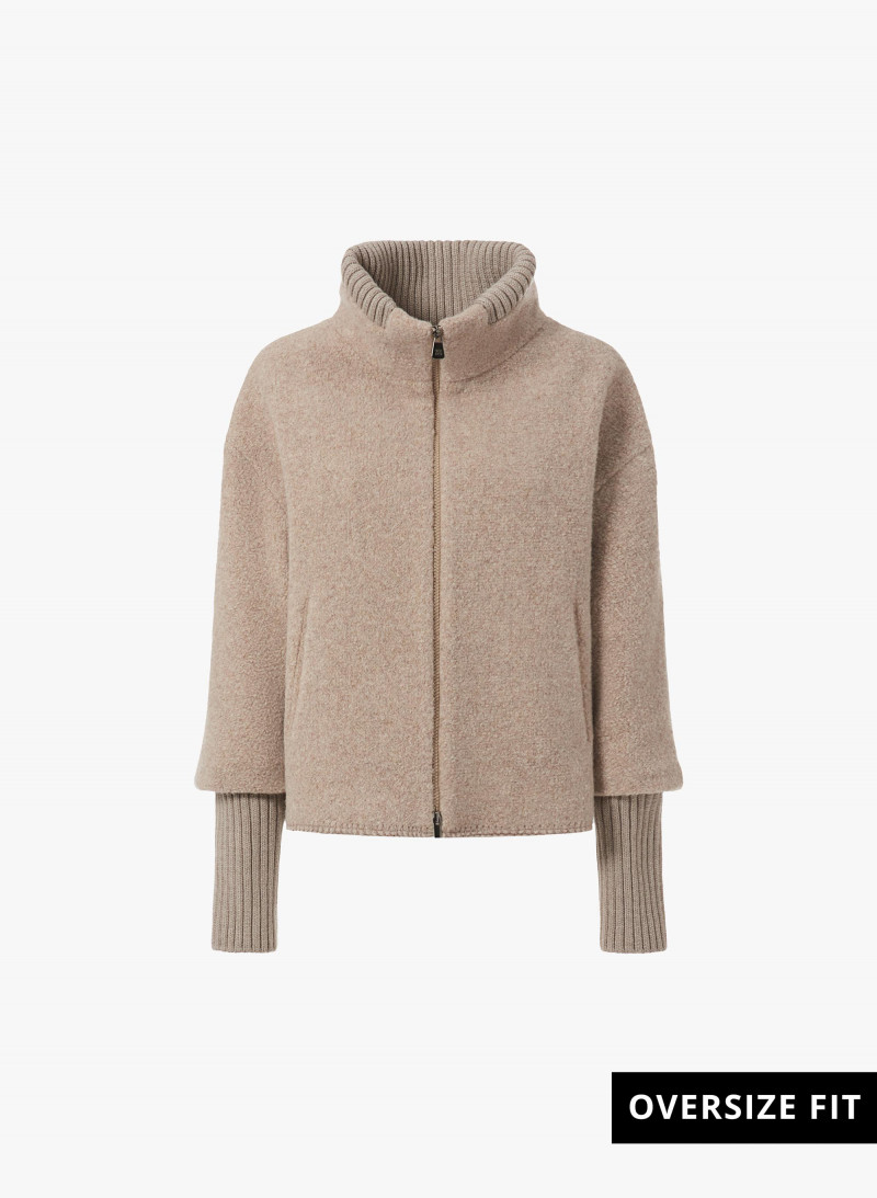 Short oversized beige coat with knitted inserts